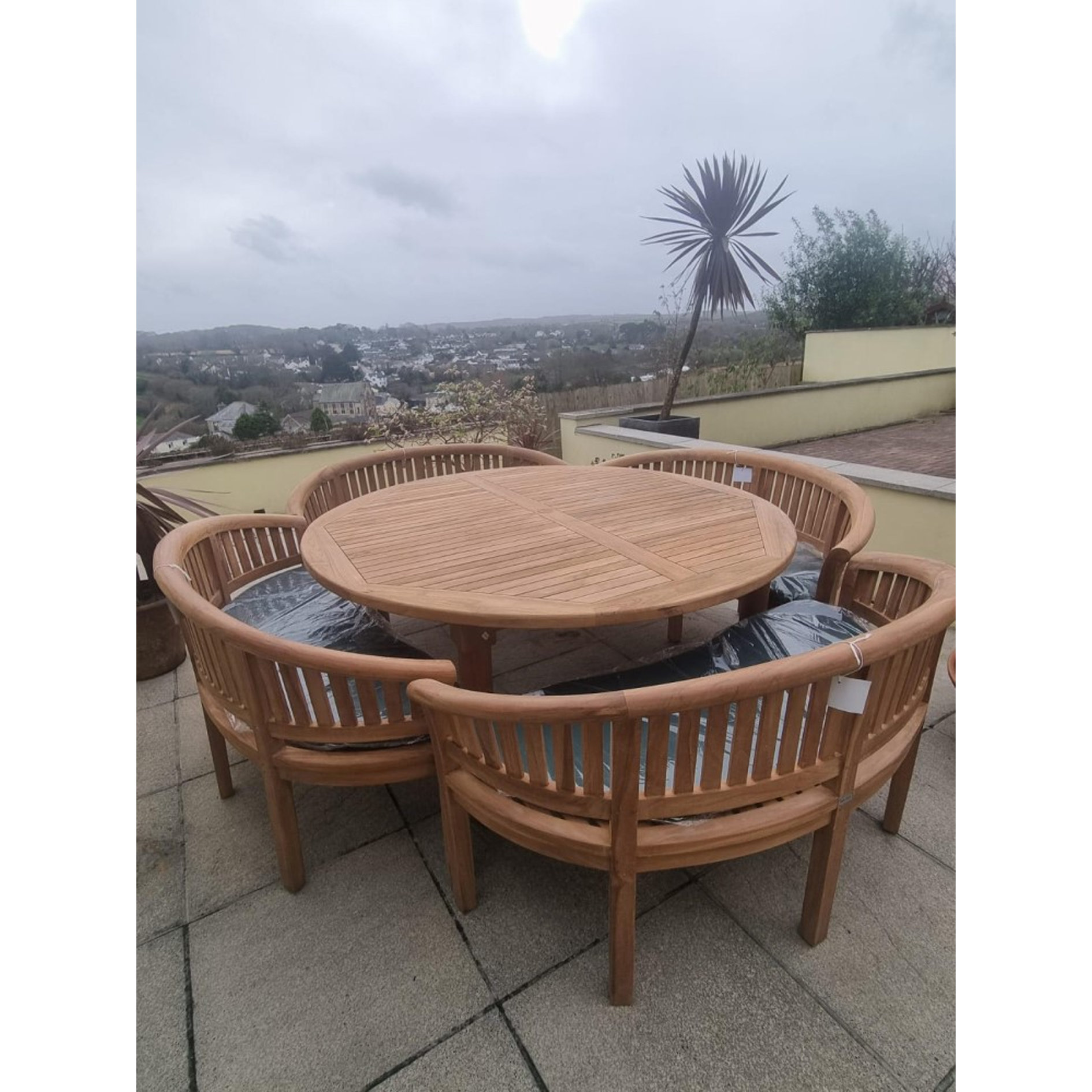 Teak garden dining set. 1.8m “Titan” round table, 4 bowwood style seats
