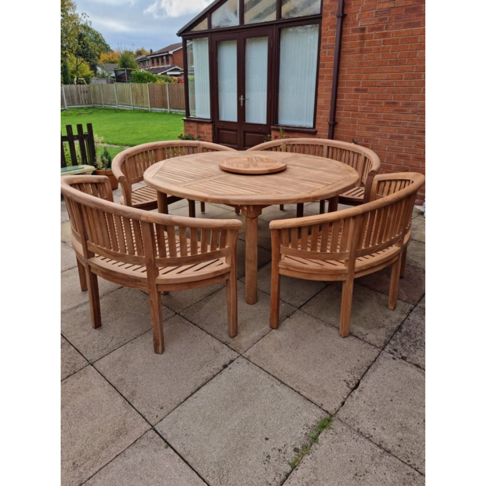 Teak garden dining set. 1.8m “Titan” round table, 4 bowwood style seats